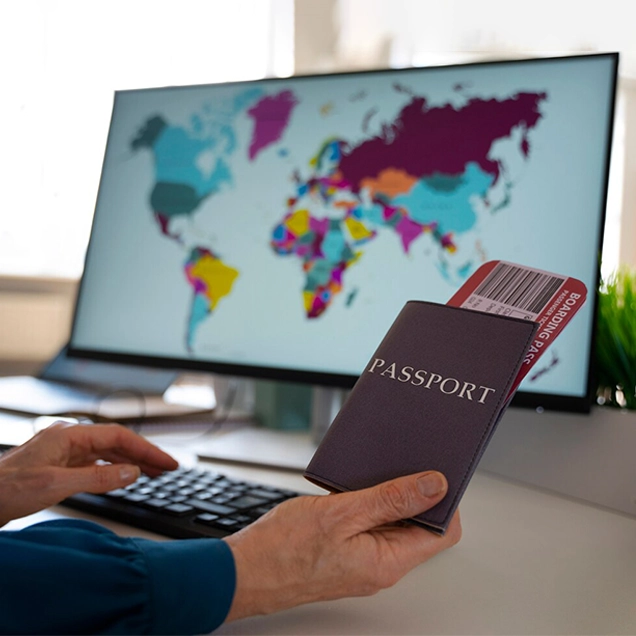 Person holding passport and boarding pass at migration service providers in Kerala